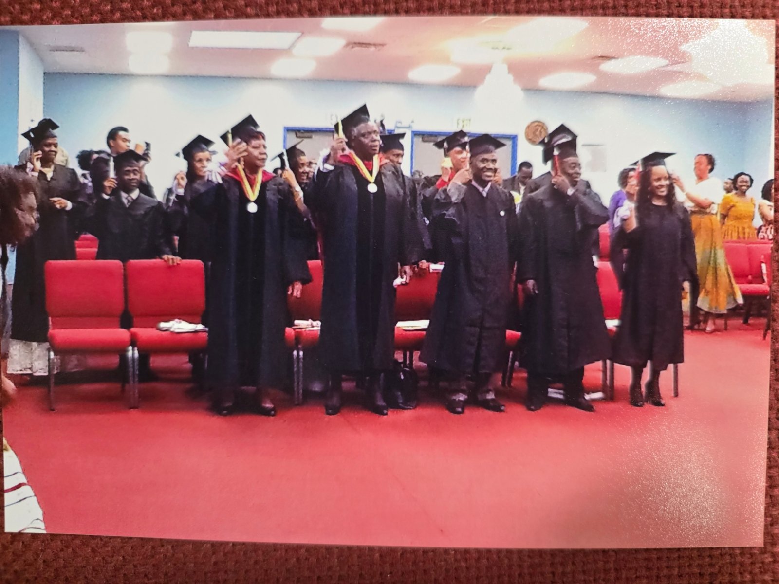 Graduates standing together at a ceremony